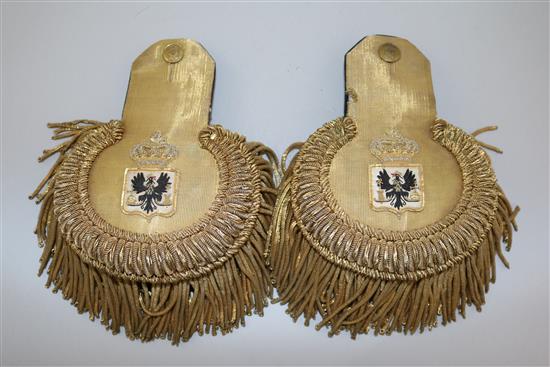A pair of early 20th century Prussian gold braid epaulettes and a bronze bust of a Prussian Hussar commander, 11in.